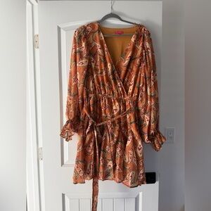 Mini boho balloon sleeve dress brand is flying tomatoes.